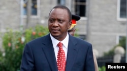 Kenya's President Uhuru Kenyatta prepares to inspect a guard of honor before the opening of the 11th Parliament at the National Assembly Chamber in Nairobi, April 16, 2013.