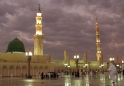 FILE -- In this July 5, 2013 photo, worshipers visit the Prophet's Mosque in Medina, Saudi Arabia.