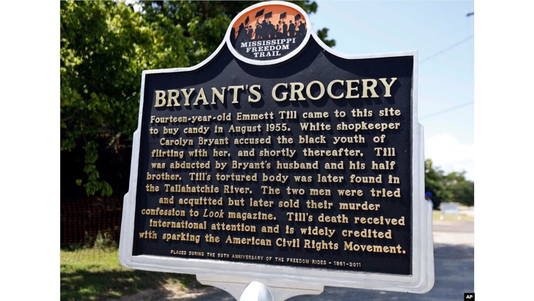 A Mississippi Freedom Trail marker recaps the significance of Bryant's Grocery and Meat Market, left, now in ruins, in Money, Miss., where in 1955, 14-year old Emmett Till allegedly whistled, grabbed and made sexual advances to a white woman.