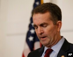Virginia Gov. Ralph Northam pauses during a news conference in the Governor's Mansion at the Capitol in Richmond, Feb. 2, 2019.