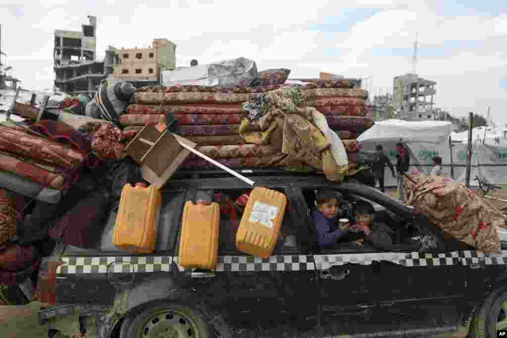 Displaced Palestinians arrive in the northern Gaza Strip, following Israel's decision to allow thousands of them to go back for the first time since the early weeks of the 15-month war with Hamas.