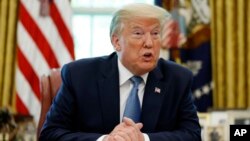 President Donald Trump speaks in the Oval Office of the White House, Friday, May 15, 2020, in Washington. (AP Photo/Alex Brandon)