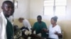 Medical personnel treat a wounded person after a mortar exploded in a neighborhood of Goma, eastern Congo, May 22, 2013.