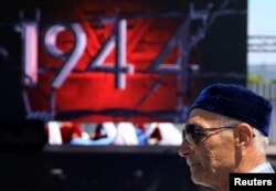 A man attends a ceremony to commemorate the anniversary of the deportation of Crimean Tatars from Crimea to Central Asia in 1944, in Bakhchysarai district of Crimea, May 18, 2016.