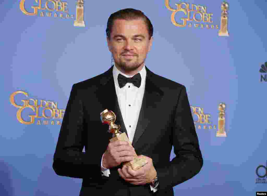 Leonardo DiCaprio poses with the award for Best Actor in a Motion Picture, Musical or Comedy for his role in "The Wolf of Wall Street" at the Golden Globe Awards in Beverly Hills, California, Jan. 12, 2014.
