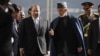 Afghan President Hamid Karzai, center right, talks with Pakistan's Prime Minister Nawaz Sharif while they inspect a guard of honor in Kabul, Afghanistan, Nov. 30, 2013. 