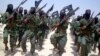 FILE - Al-Shabab fighters march with their weapons during military exercises on the outskirts of Mogadishu, Somalia, Feb. 17, 2011. Missiles fired Feb. 21, 2018, targeted a rickshaw carrying al-Shabab militants near Jamaame, in the southern Lower Juba region, causing several deaths, officials said.