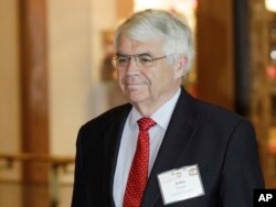 FILE - John Taylor, of Stanford University, arrives for a dinner at the Jackson Hole Economic Symposium near Jackson Hole, Wyo., Aug. 30, 2012.