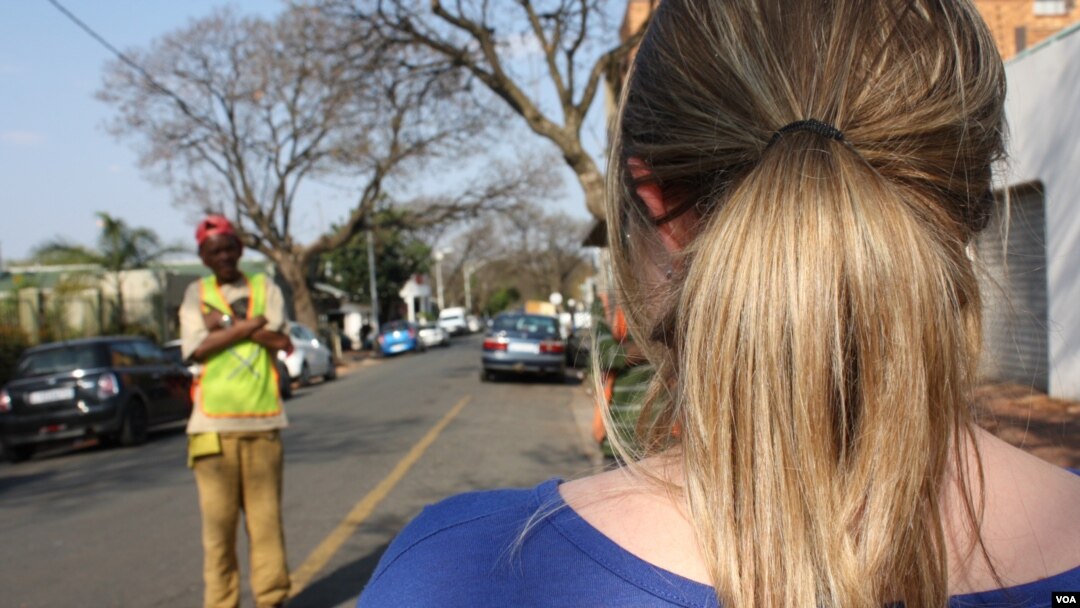 This young woman, who asked to remain anonymous, alleges the Metro Police assaulted her and accused her of driving drunk, at this intersection in Johannesburg, Sept. 11, 2015. (VOA / D. Taylor)