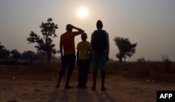 FILE - These three children living in the camp for internally displaced people of Mpoko claimed to be victims or witnesses of sexual abuse on minors by peacekeeper soldiers of the French Sangaris operation, in Bangui, Central African Republic, Feb. 11, 2016.
