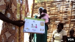FILE - A health worker explains birth control at a clinic outside Juba, South Sudan. (H. McNeish/VOA)