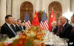 FILE - President Donald Trump speaks with China's President Xi Jinping during their bilateral meeting in Buenos Aires, Argentina, Dec. 1, 2018.