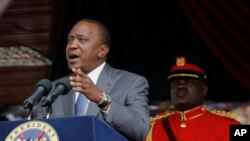 FILE - Kenya President Uhuru Kenyatta delivers a speech during Mashujaa Day -- also known as Heroes Day -- at the Nyayo Nationa Stadium, in Nairobi, Kenya, Oct. 20, 2014. 