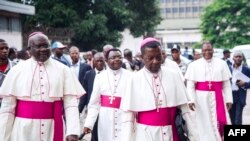 FILE - Archbishop Marcel Utembi, second left, president of the National Episcopal Conference of Congo (CENCO), and other Catholic bishops arrive for the signing of an accord at the interdiocesan center in Kinshasa, Jan. 1, 2017 following talks launched by