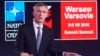 NATO Secretary General Jens Stoltenberg, right, speaks during the Warsaw Experts Forum prior to the official opening of the NATO summit in Warsaw, Poland, July 8, 2016.