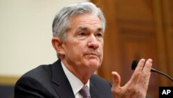 Federal Reserve Chairman Jerome Powell gestures while he testifies to the House Financial Services Committee, Feb. 27, 2018, in Washington.