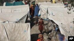 Internally displaced Afghans from northern provinces, who fled their home due to fighting between the Taliban and Afghan security personnel, take refuge in a public park Kabul, Aug. 13, 2021.