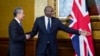 British Foreign Secretary David Lammy, right, welcomes Chinese Foreign Minister Wang Yi ahead of a meeting in London, Feb. 13, 2025.
