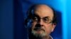 FILE PHOTO: British author Salman Rushdie listens during an interview with Reuters in London