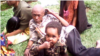 A captured jihadist ADF combatant and child (Yassin Kombi/VOA)