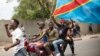 Civilians participate in a protest in support of the FARDC in Goma