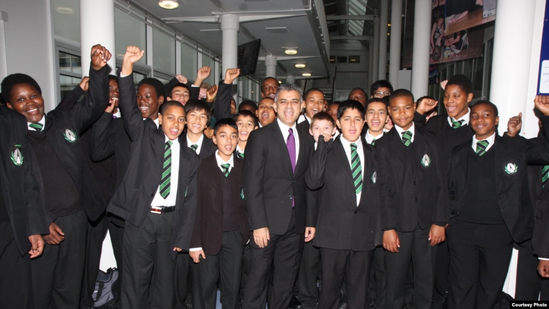 Sadiq Khan gathers with current students during a 2011 visit to his school in London's ethnically diverse Tooting neighborhood. (Photo courtesy of Ernest Bevin College)