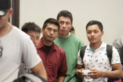 Asylum-seekers from Guatemala board a Greyhound bus in El Paso, Texas, April 2, 2019. They say they spent four days sleeping on rocks under a bridge in a detention area that U.S. immigration officials have since dismantled.