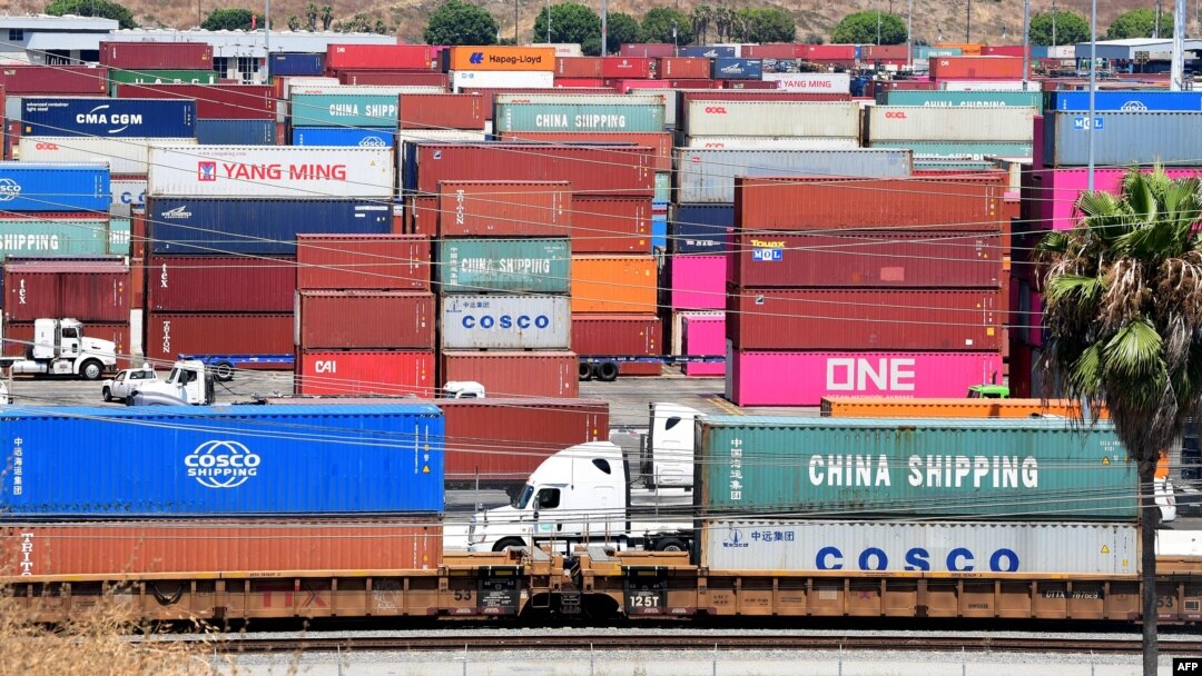 FILE - Container trucks arrive at the Port of Long Beach in Long Beach, Calif., August 23, 2019. Washington is moving ahead Sept. 1, 2019, with new tariffs on Chinese imports.