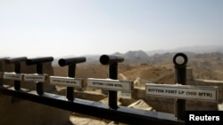 Location and range information is seen on a wall in the Kitton outpost along the border fence on the border with Afghanistan in North Waziristan, Pakistan, Oct. 18, 2017. 
