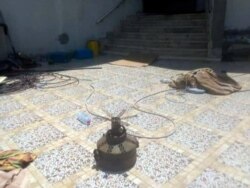 This undated handout photo obtained July 15, 2020, courtesy of AFRICOM, shows a verified image of a booby-trapped anti-personnel mine connected to the Russia-financed Wagner Group, found in a residential area in Tripoli.