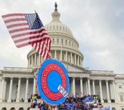 FILE - Trump supporters breach the US Capitol Building in Washington, Jan. 6, 2020.