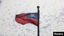 FILE PHOTO: A Taiwanese flag flaps in the wind in Taoyuan, Taiwan, June 30, 2021. REUTERS/Ann Wang/File Photo