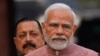 FILE - Indian Prime Minister Narendra Modi, center, addresses the media on the opening day of the winter session of the Parliament, in New Delhi, India, Dec. 7, 2022. 