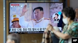 A North Korean flag flutters in the wind near the border villages of Panmunjom in Paju, South Korea, Oct. 4, 2022. North Korea on Tuesday fired an intermediate-range ballistic missile over Japan for the first time in five years.