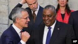 NATO Secretary General Jens Stoltenberg, left, speaks with U.S. Secretary for Defense Lloyd J. Austin III at NATO headquarters in Brussels, Oct. 13, 2022. On Monday, NATO began its annual nuclear exercises in Europe as tensions simmer over the war in Ukraine.