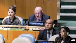 Vassily Nebenzia, Russia's U.N. ambassador, second from left, addresses the U.N. General Assembly before it voted on a resolution condemning Russia's illegal referendum in Ukraine, Oct. 12, 2022, at U.N. headquarters.
