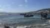 FILE - This handout picture released by the Hellenic Coast Guard on June 19, 2022 shows rescued migrants during their transfer to Mykonos island. (AFP photo / Hellenic Coast Guard) 