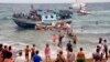 Vacationers joined Italian Coast Guard officers to help migrants from Eritrea ashore two years ago in August near the seaport of Siracusa after a long and treacherous journey.
