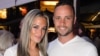 Olympian sprinter Oscar Pistorius posing next to his girlfriend Reeva Steenkamp at Melrose Arch in Johannesburg, Jan. 26, 2013.