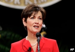 FILE - In this Jan. 16, 2015, photo, Iowa Lt. Gov. Kim Reynolds delivers remarks after taking the oath of office during inauguration ceremonies in Des Moines.
