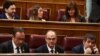 FILE - Jailed Catalan politicians Jordi Sanchez, Josep Rull and Jordi Turull attend the first session of parliament following a general election in Madrid, Spain, May 21, 2019.