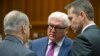 German Foreign Minister Frank-Walter Steinmeier, center, speaks with Cypriot Foreign Minister Ioannis Kasoulides, left, and Danish Foreign Minister Kristian Jensen, right, during a meeting of EU foreign ministers at the EU Council building in Brussels, Nov. 14, 2016.