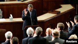FILE - Outgoing House Speaker John Boehner departs the podium during a standing ovation after he addressed colleagues during the election for the new Speaker of the U.S. House of Representatives in the House Chamber in Washington, Oct. 29, 2015.