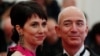 FILE - Mackenzie Scott, then using the last name Bezos, and her then-husband Amazon CEO Jeff Bezos, arrive at the Metropolitan Museum of Art Costume Institute Benefit in New York, May 7, 2012.