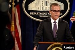 FILE - FBI Deputy Director Andrew McCabe holds a news conference in Washington, July 20, 2016.