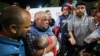 Al-Jazeera correspondent Wael Al-Dahdouh mourns over the body of one of his three children who were killed along with his wife in an Israeli strike in the Nuseirat camp, at Al-Aqsa hospital in Deir Al-Balah on the southern Gaza Strip, on Oct. 25, 2023. 