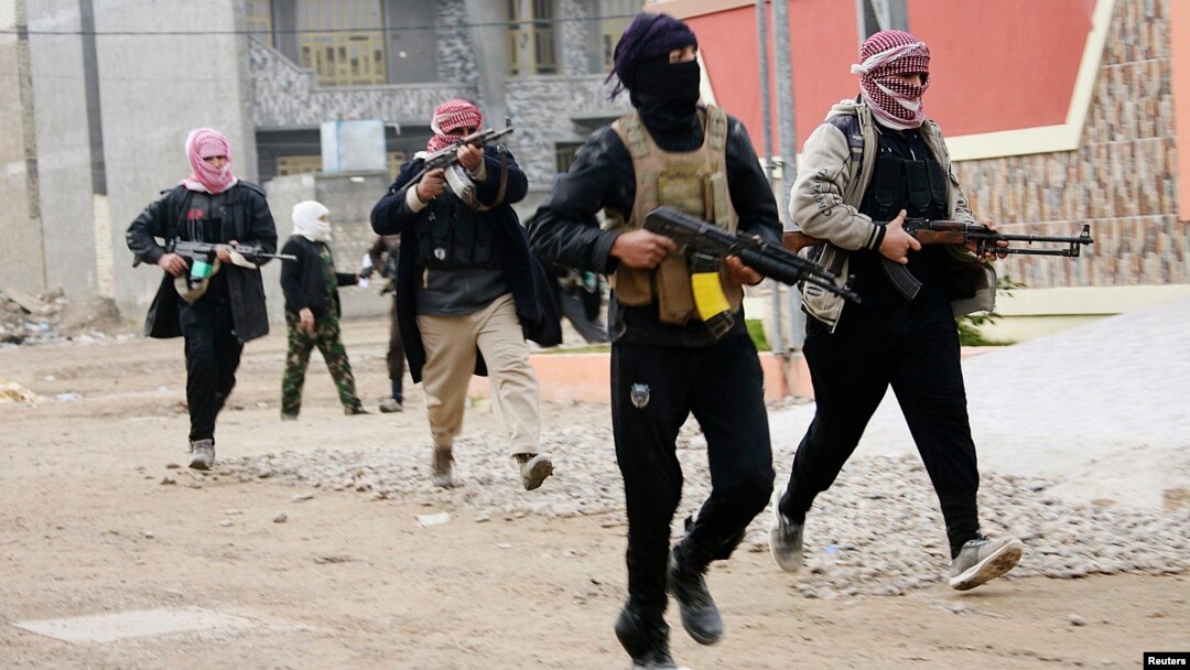 Iraqi tribal fighters who have been deployed onto the streets, patrol in the city of Fallujah, west of Baghdad Jan. 5, 2014. 