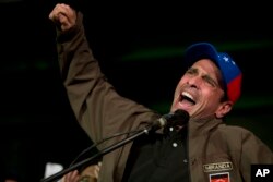 Venezuelan opposition leader Henrique Capriles speaks to supporters during a meeting in Caracas, Venezuela, April, 7, 2017.