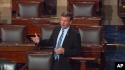 FILE - Sen. Chris Murphy speaks on the floor of the Senate on Capitol Hill, June 15, 2016, during a filibuster demanding a vote on gun control measures.