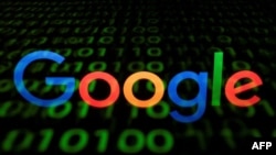 (FILES) This file photo taken in Paris on April 29, 2018 shows the Google logo displayed on a screen and reflected on a tablet. - Dozens of US states joined forces in a lawsuit filed on July 7, 2021 accusing Google of abusing its power when it comes…